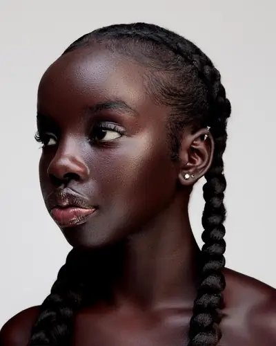 Close-up beauty portrait of Joy with long braids