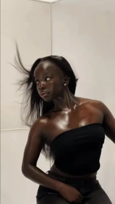 Behind the scenes: Joy flipping her hair in a black bandeau