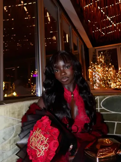 Joy in red lace with roses and holiday lights