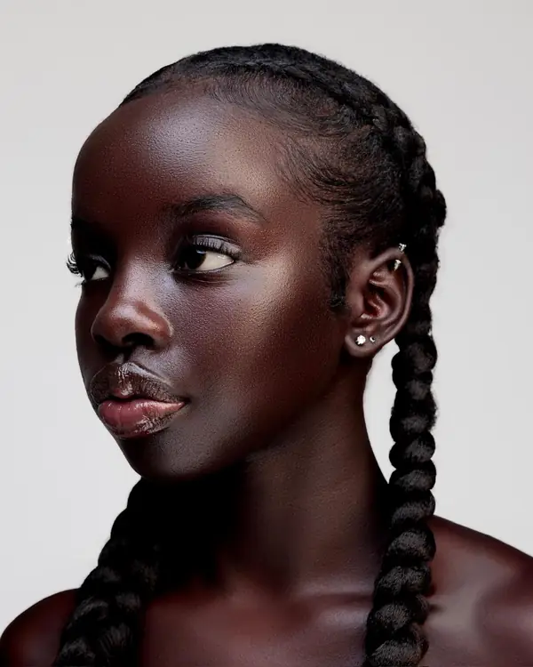 Close-up beauty portrait of Joy with long braids