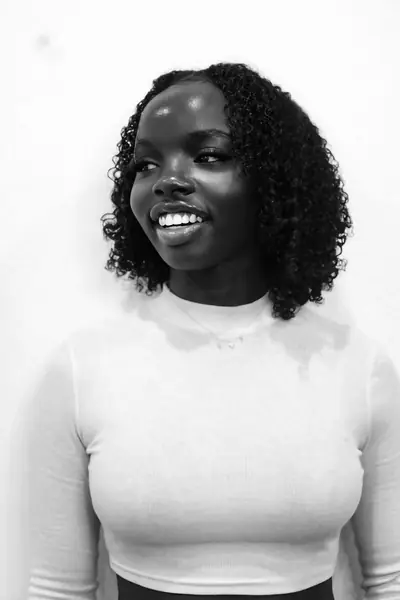Black and white portrait of Joy smiling